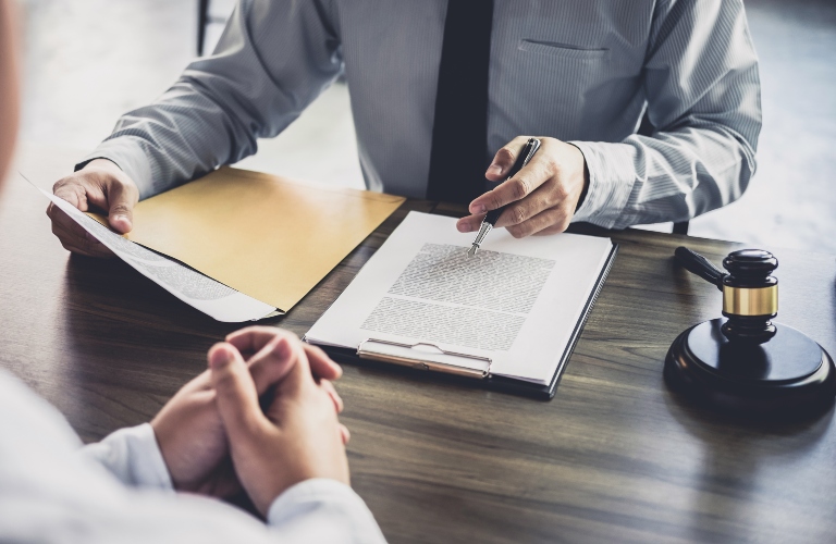 lawyer discusses documents with client before signing