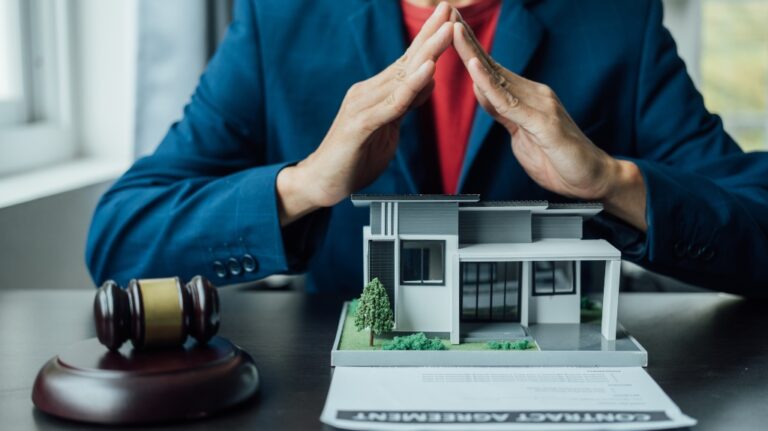 real estate attorney with house model and judge gavel