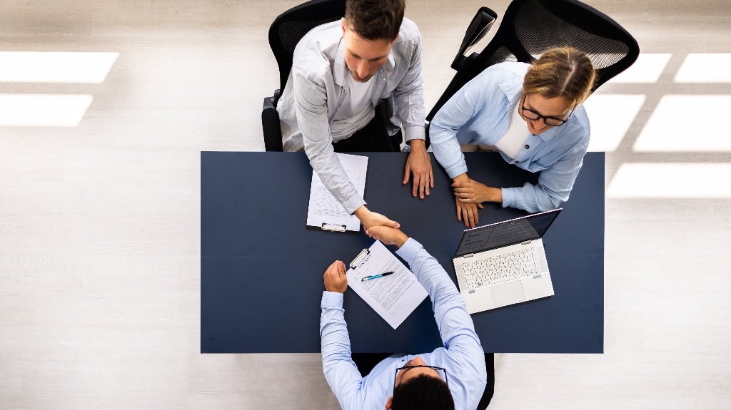 couple is consulting with real estate attorney