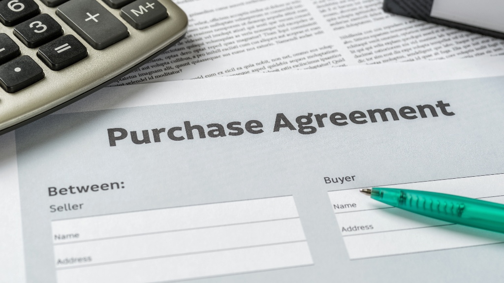 Purchase agreement with a pen on a desk