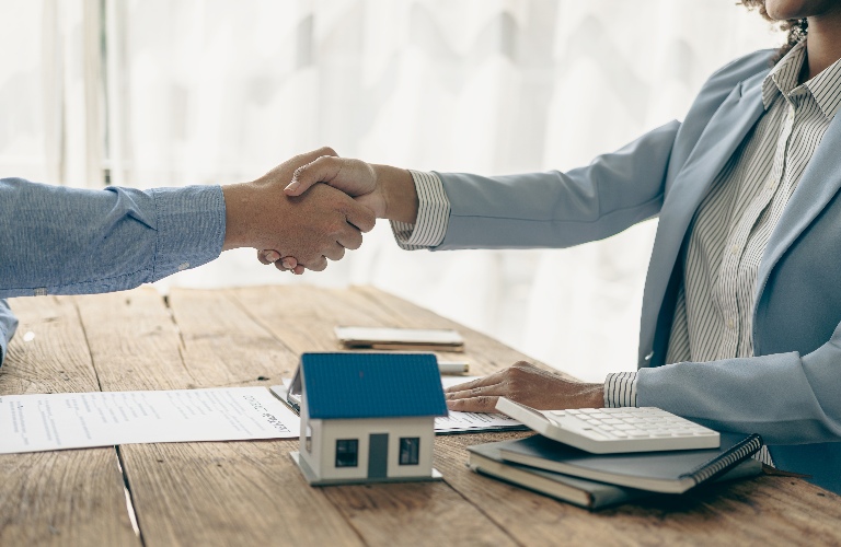 real estate attorney and client are reviewing purchase agreement