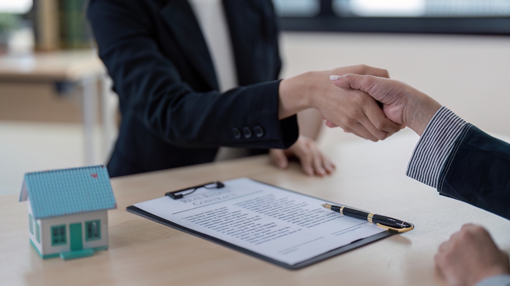 Real Estate lawyer shaking hands with client