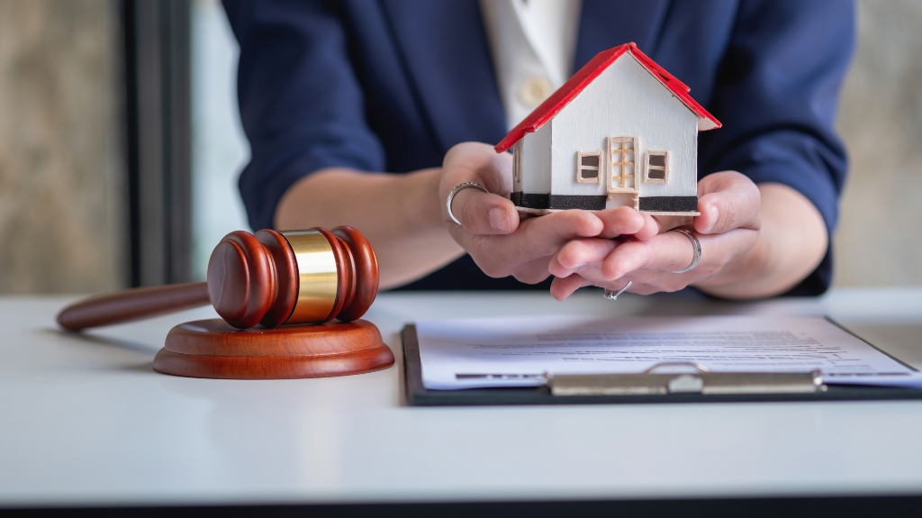 lawyer-holding-wooden-model-of-house_s
